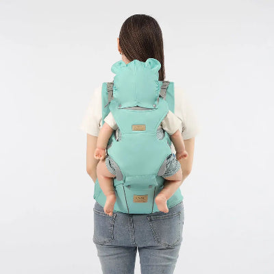 bebe sur dos de maman dans porte bebe physiologique